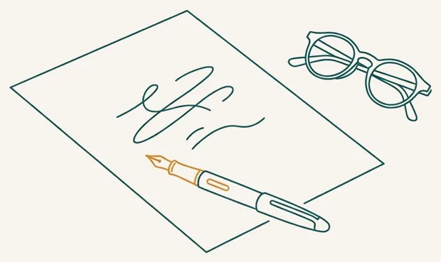 Feuille d'ordonnance et stylo posés sur un bureau